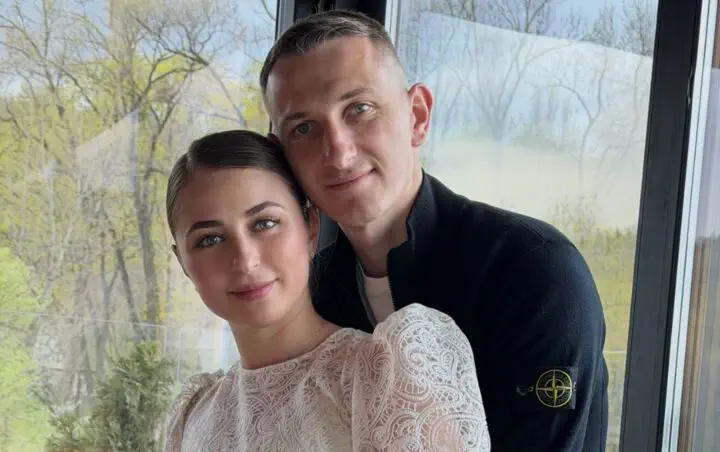 Дмитро Різник з дружиною