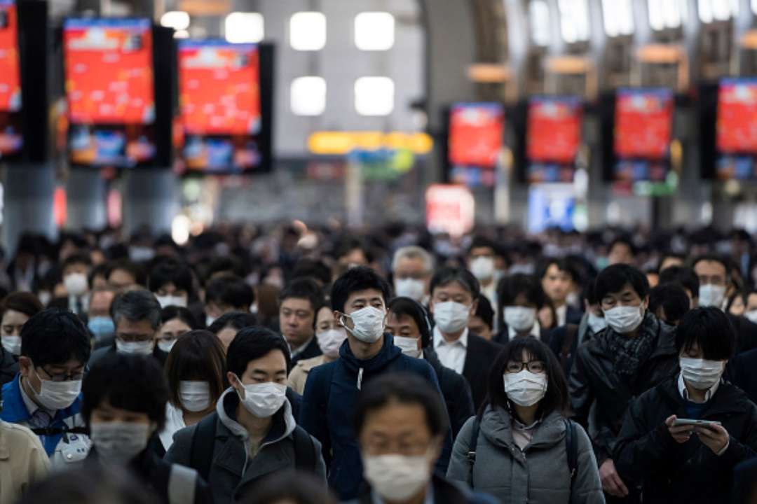 В Китае закрыли на карантин целый город/Фото: Tomohiro Ohsumi/Getty Images В Китае закрыли на карантин целый город, в котором проживает 21 миллион людей